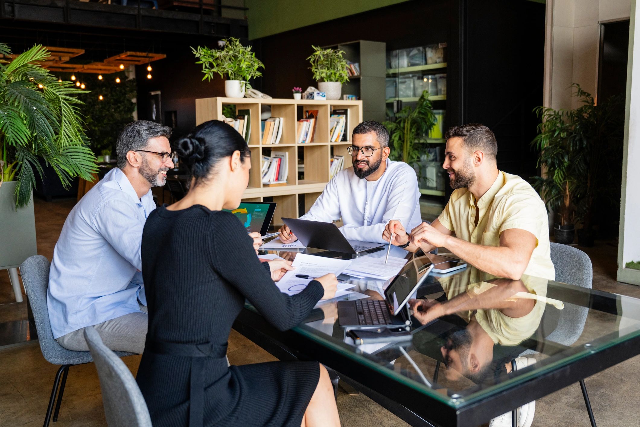Small group of business colleagues collaborating in a modern office meeting